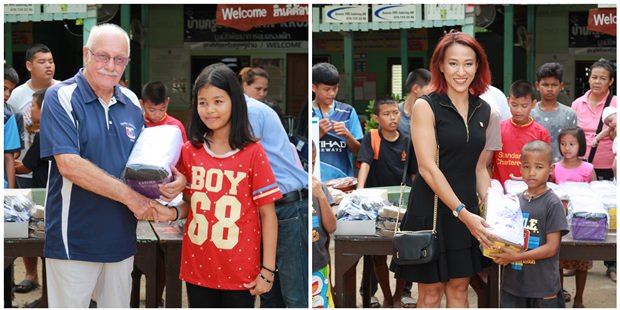 Mitglieder des Pattaya Sports Club geben Geschenke an die Kinder. 