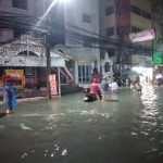 t-08 Pattaya tourists wade through flashfloods in Walking Street, Soi Bua khao on Sunday evening 11