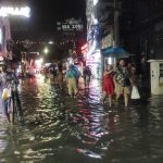 t-08 Pattaya tourists wade through flashfloods in Walking Street, Soi Bua khao on Sunday evening 12