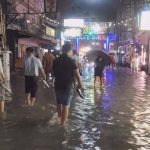 t-08 Pattaya tourists wade through flashfloods in Walking Street, Soi Bua khao on Sunday evening 6