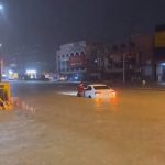 t-08 Pattaya tourists wade through flashfloods in Walking Street, Soi Bua khao on Sunday evening 9